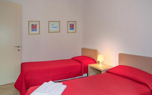 Ένα ή περισσότερα κρεβάτια σε δωμάτιο στο Residence San Rossore