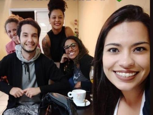 a group of people are posing for a picture at Vila do Chaves bed breakfast in Sao Paulo