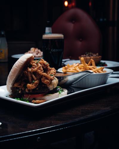 a plate of food with a sandwich and french fries at Beechlawn Hotel in Belfast