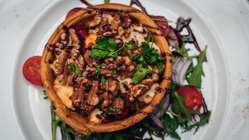 a plate of food on a plate with a salad at Beechlawn Hotel in Belfast
