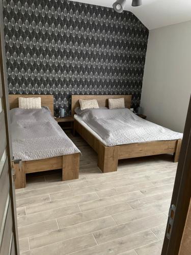 Кровать или кровати в номере Sirály 2 Apartman