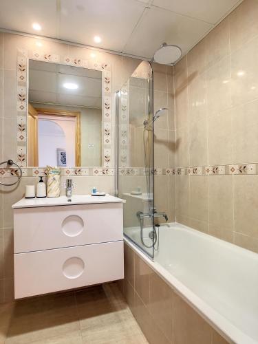 a bathroom with a tub and a sink and a shower at Ribera Beach 3 - 6606 in Mar de Cristal