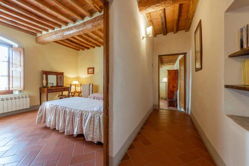 a bedroom with a bed in a room at Agriturismo I Bonsi in Reggello