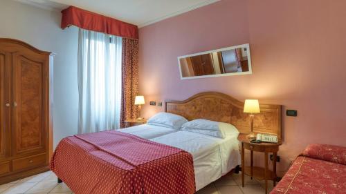 Katil atau katil-katil dalam bilik di Primotel Brescia