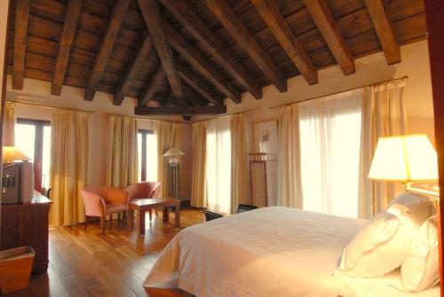 Postel nebo postele na pokoji v ubytování Hotel El Rancho