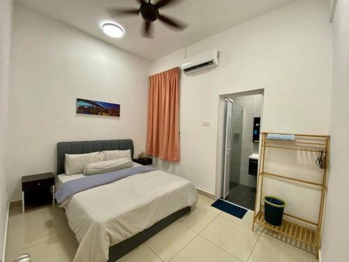 a bedroom with a bed and a ceiling fan at SWEET HOME SKY GARDEN@BM in Bukit Mertajam