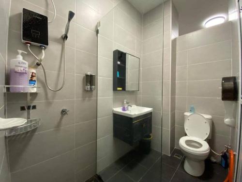 a bathroom with a toilet and a sink and a shower at SWEET HOME SKY GARDEN@BM in Bukit Mertajam