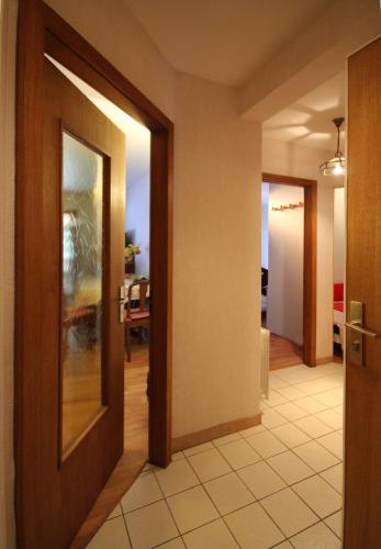 a hallway with two doors leading to a living room at Appartement Adélaïde in Le Hohwald