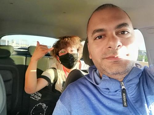 a man sitting in a car wearing a mask at david hostel in Aswan