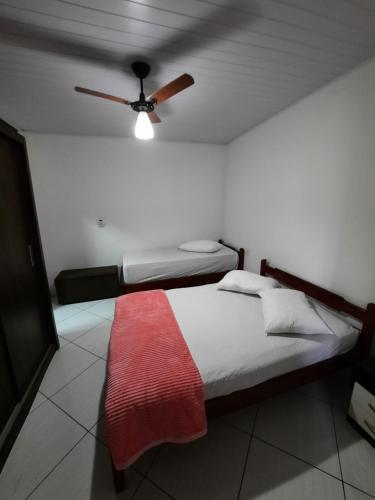 Ένα ή περισσότερα κρεβάτια σε δωμάτιο στο Coração de mãe