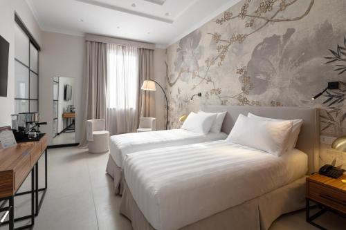 Posteľ alebo postele v izbe v ubytovaní Hotel Poerio 25 Boutique Stay