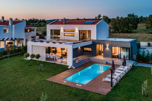 an aerial view of a house with a swimming pool at Villa Sabina in Višnjan