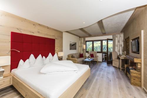 Alpbacherhof Mountain & Spa Resortにあるベッド