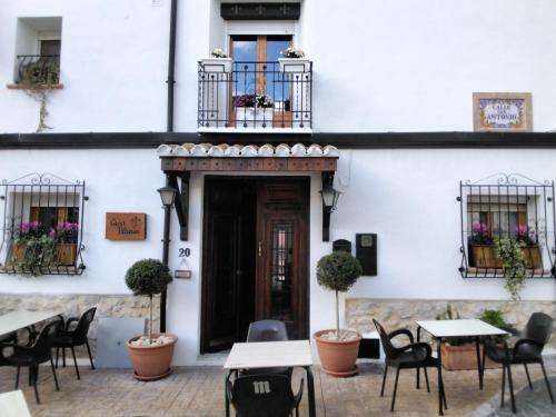 a restaurant with tables and chairs in front of a building at Casa Blanca in Castell de Castells