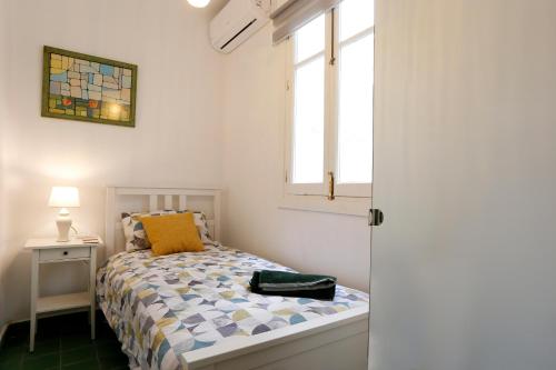 Llit o llits en una habitació de Bonito Apartamento a un paso del centro.