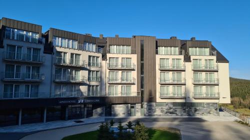 a rendering of the exterior of an apartment building at Aparthotel Apartamenty Czarna Góra 340 in Sienna