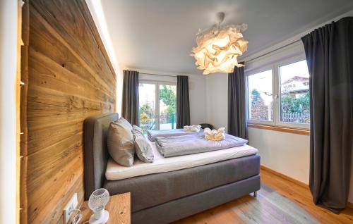 a living room with a couch and a chandelier at Chalet Alpenspirit in Garmisch-Partenkirchen