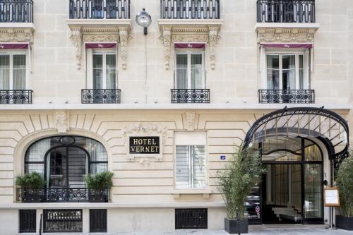 a building in paris with a hotel wanted sign on it at Hôtel Vernet Champs Elysées Paris in Paris