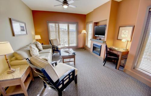 a living room with a couch and a tv at Spirit Ridge, in The Unbound Collection by Hyatt in Osoyoos