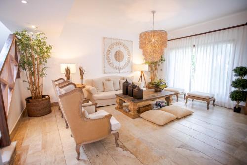 a living room with a couch and a table at Xeliter Balcones del Atlantico - Las Terrenas in Las Terrenas