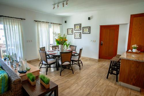 a dining room and living room with a table and chairs at Xeliter Balcones del Atlantico - Las Terrenas in Las Terrenas
