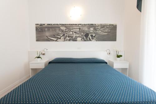 Ένα ή περισσότερα κρεβάτια σε δωμάτιο στο Hotel Marina