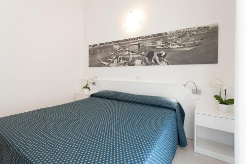 Ένα ή περισσότερα κρεβάτια σε δωμάτιο στο Hotel Marina