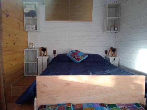 Llit o llits en una habitació de PalletsSuites
