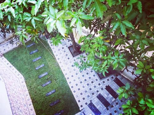 an overhead view of a building with trees and grass at Sunnyplace Guest Mirissa in Mirissa