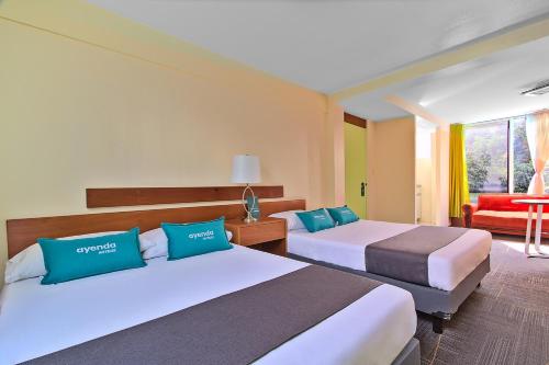 Cama o camas de una habitación en Hotel Suites Marne