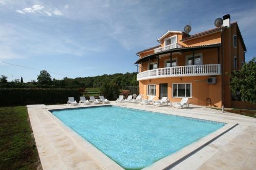 an image of a villa with a swimming pool at Apartments Šeherzada in Pula