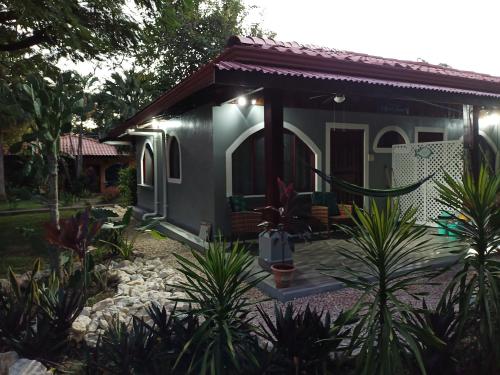 a small house with a patio and plants at Gray Beach House in Potrero