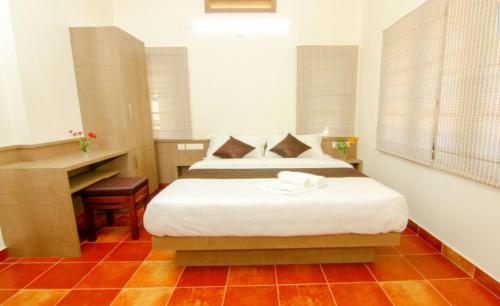 Ένα ή περισσότερα κρεβάτια σε δωμάτιο στο Dakshin Ghats