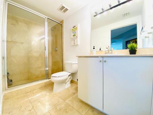a bathroom with a toilet and a shower at The King David Condos in Miami Beach