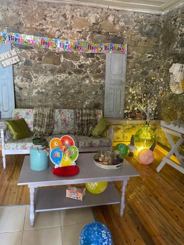 a living room with a table and a couch at Holiday House Prodromos in Prodromos