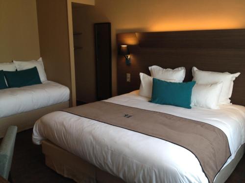 Una cama o camas en una habitación de Moka Hotel