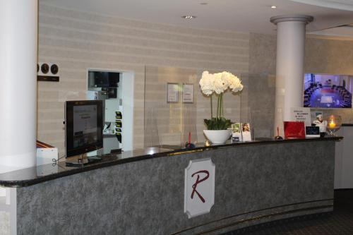 a bar in a hotel with a sign on it at Hotel Residenz Bad Frankenhausen in Bad Frankenhausen