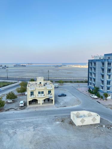 an aerial view of a house and a building at Alhama Hotel Appartment in Khasab