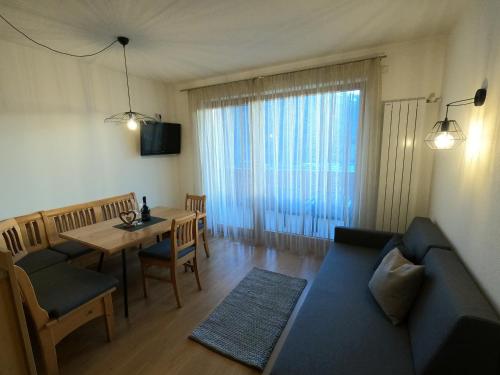 a living room with a couch and a table at Residence Sonnberg in Perca