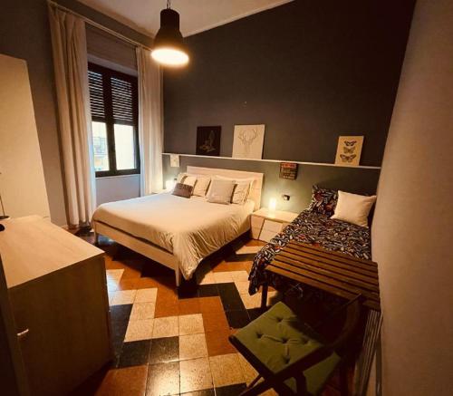 a bedroom with two beds and a window at Lavilletta B&B in Salerno