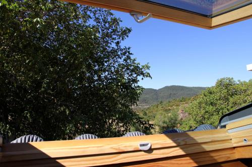 a view from the porch of a house with chairs at Casa Rural Ardantzena in Ardaiz