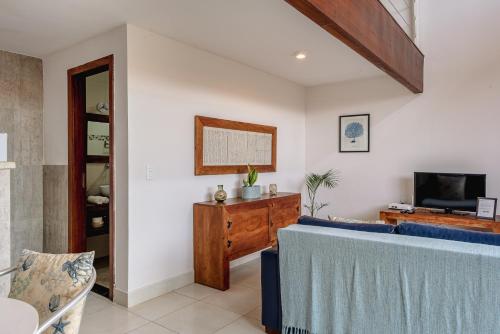Televisyen dan/atau pusat hiburan di Mata Hari Apartamentos