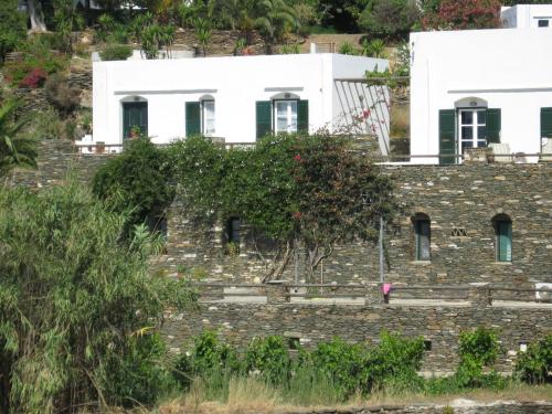 a building on the side of a hill at Apollon-Artemis Apartments in Apollonia
