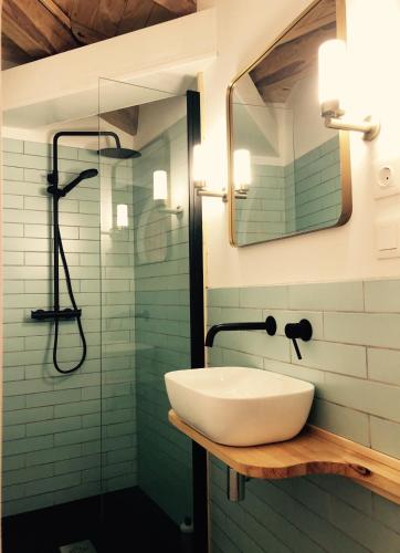 a bathroom with a sink and a shower at Penamacor Cozy Nook House in Penamacor
