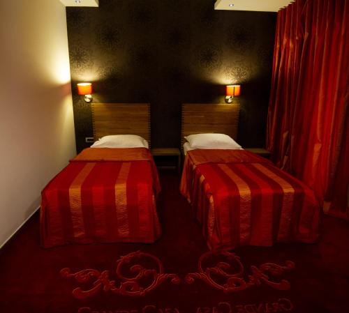 Una cama o camas en una habitación de GRANDE CASA Hotel - Međugorje