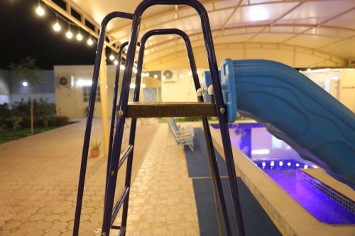 a playground with a slide in a building at Aljood Resort in Ras al Khaimah
