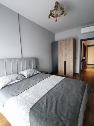 a bedroom with a large bed and a ceiling fan at BENESTA BEYOGLU in Istanbul