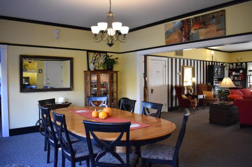a dining room with a table with fruit on it at Bayberry Inn B&B and Oregon Wellness Retreat in Ashland
