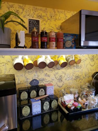 a shelf with various items on it in a kitchen at Bayberry Inn B&B and Oregon Wellness Retreat in Ashland