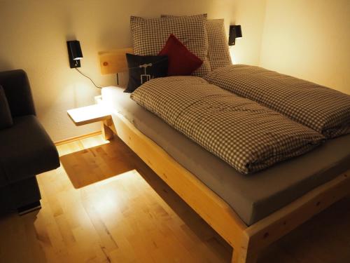 מיטה או מיטות בחדר ב-Ferienwohnung Grüntenpanorama im Jägerwinkl Allgäu